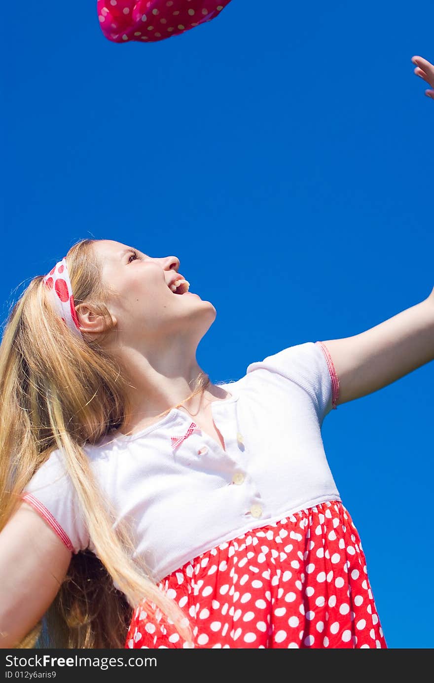 Expressive young girl on blue sky background. Expressive young girl on blue sky background