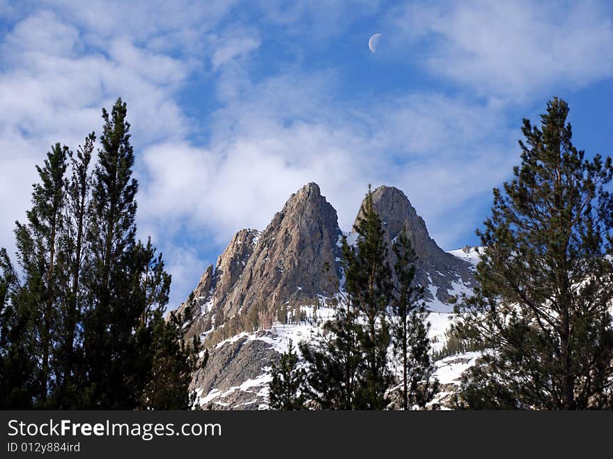 Sunrise over June Lake peak, while the moon is still out. Sunrise over June Lake peak, while the moon is still out