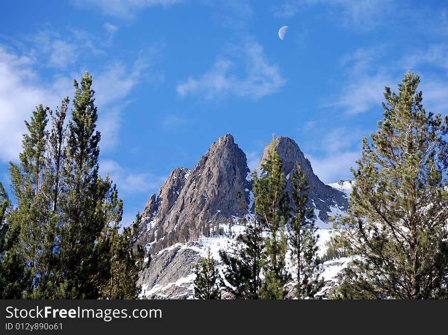 Sunrise over June Lake  peak, while the moon is still out. Sunrise over June Lake  peak, while the moon is still out