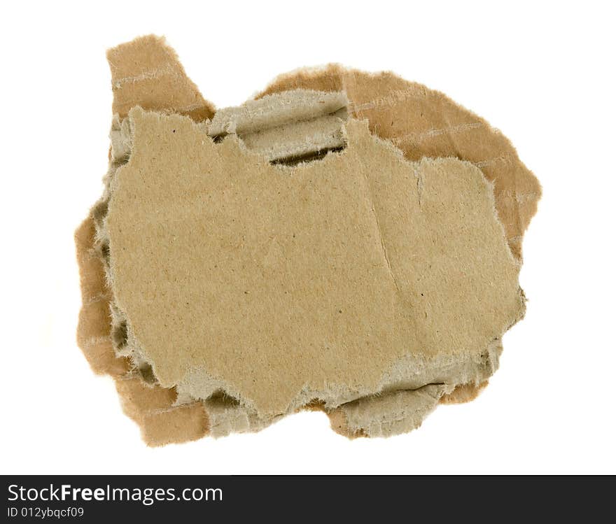 Torn piece of corrugated fiberboard isolated on a white background