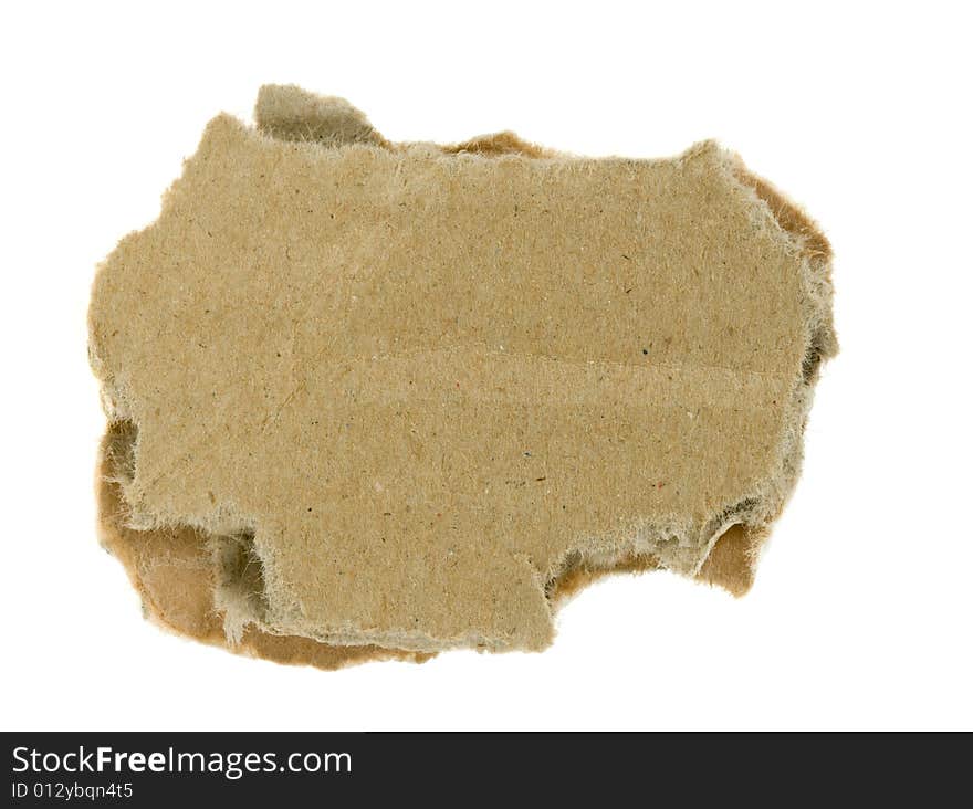 Torn piece of corrugated fiberboard isolated on a white background