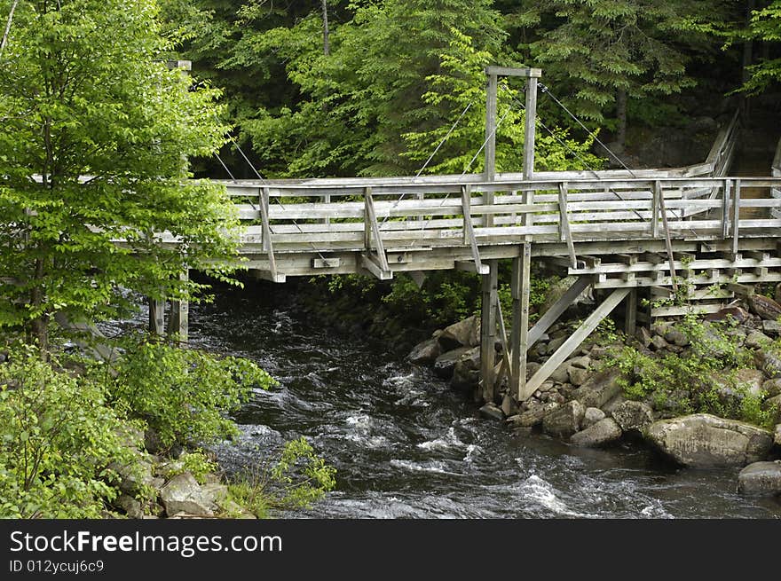 Wooden bridge over a small river