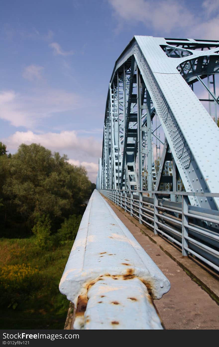 Blue bridge over river in Poland