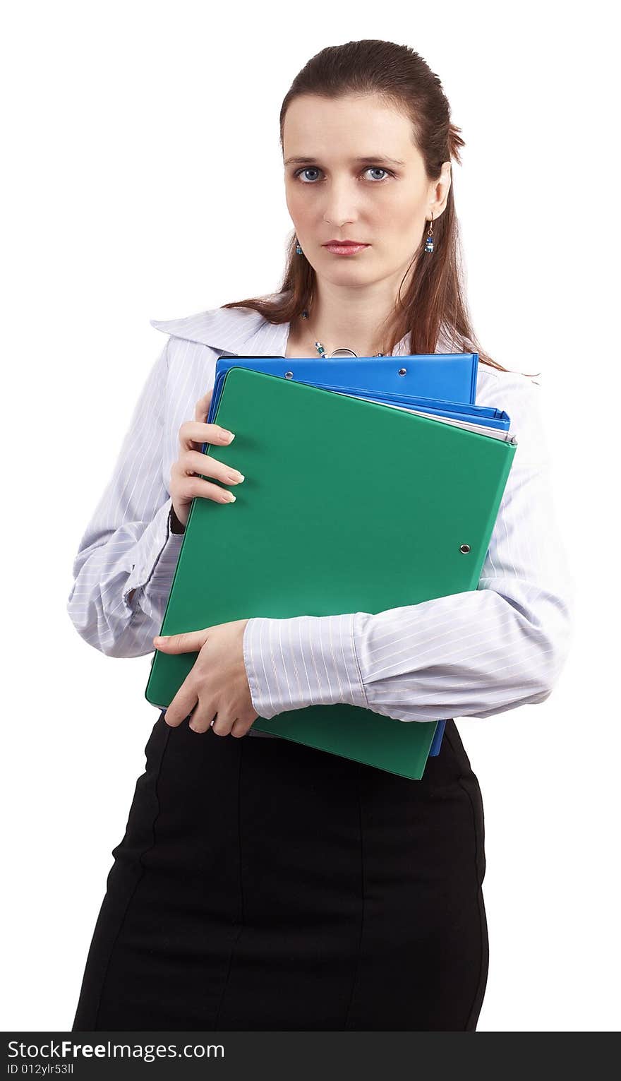 Beautiful brunette businesswoman wearing a blue shirt and a skirt, holding files and folders. Isolated on white background with copy space