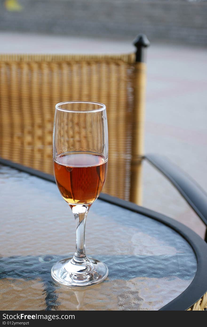 Glass of wine sitting on the table. Glass of wine sitting on the table.