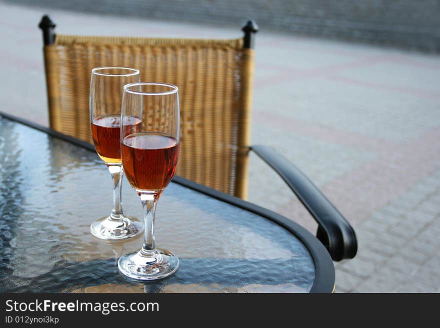 Tow glasses of wine sitting on the table. Tow glasses of wine sitting on the table.