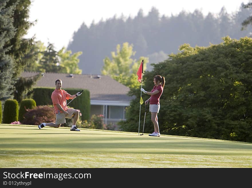 Couple Playing Golf - Horizontal