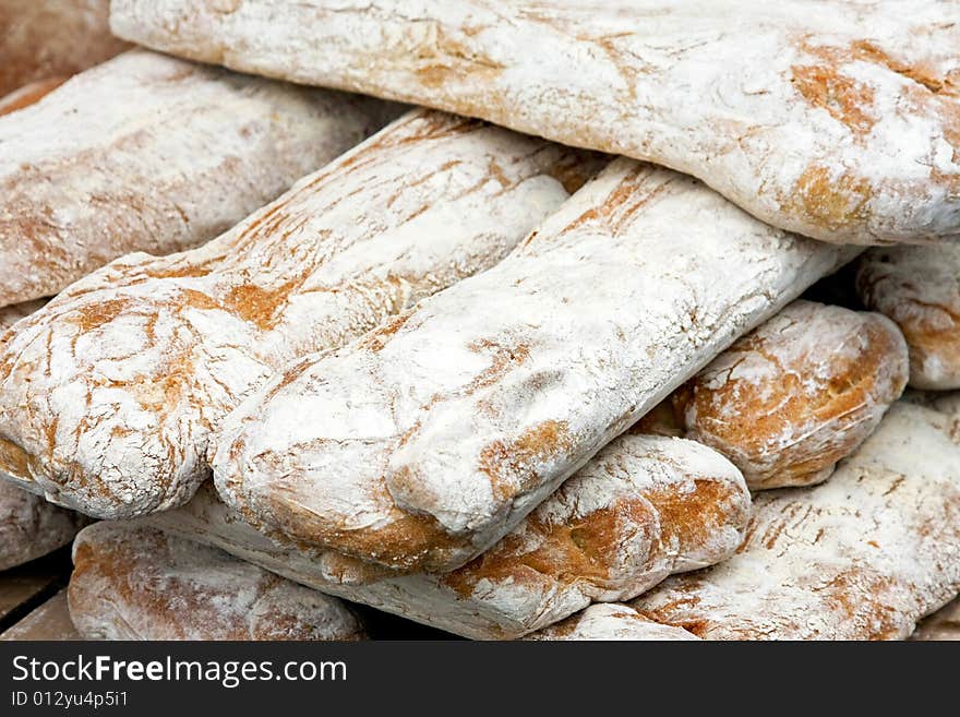 Bunch of white bread sticks on the market