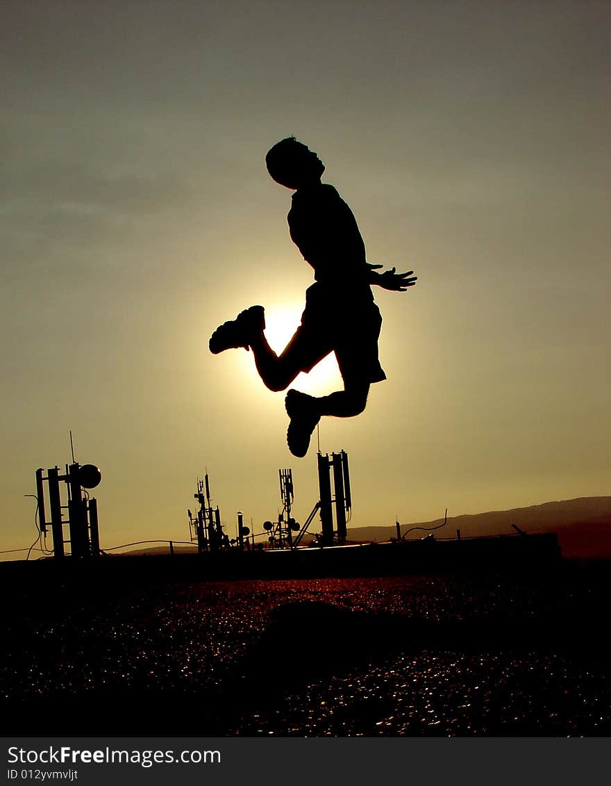 Silhouette on the roof. Sunset sky. Silhouette on the roof. Sunset sky