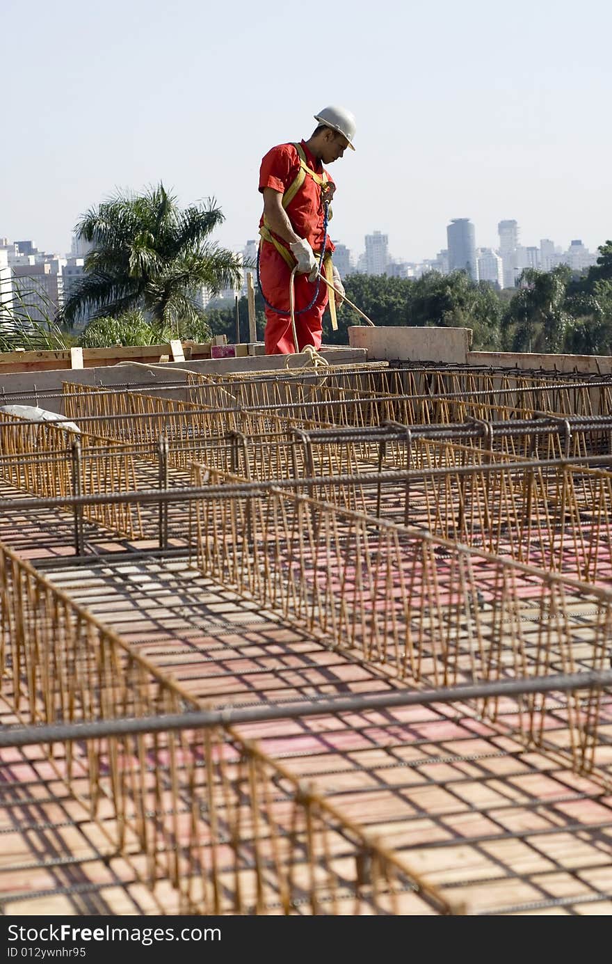 Worker Installs Rebar