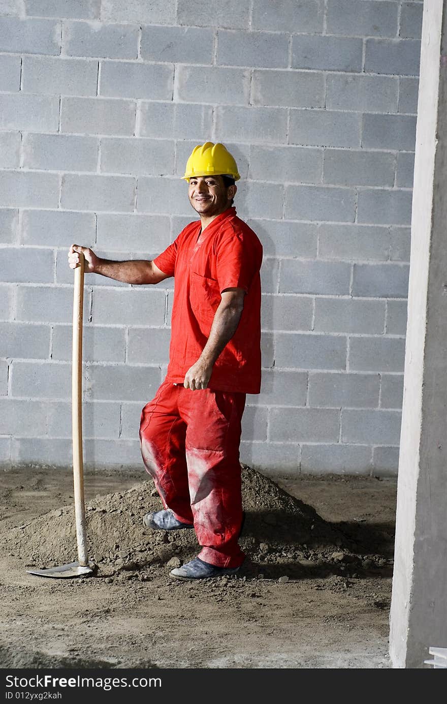 Worker Stands Next To Dirt Pile