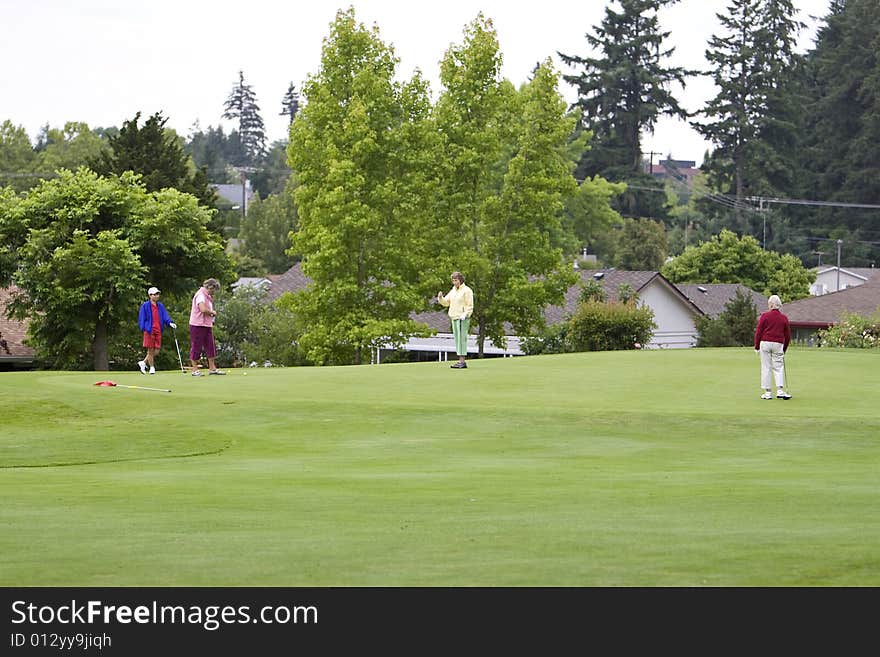 Group of elderly women playing golf. Horizontally framed photo. Group of elderly women playing golf. Horizontally framed photo.