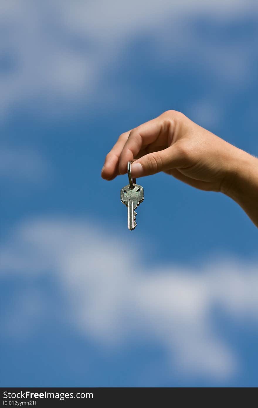 Woman handing another woman keys to a house. Woman handing another woman keys to a house