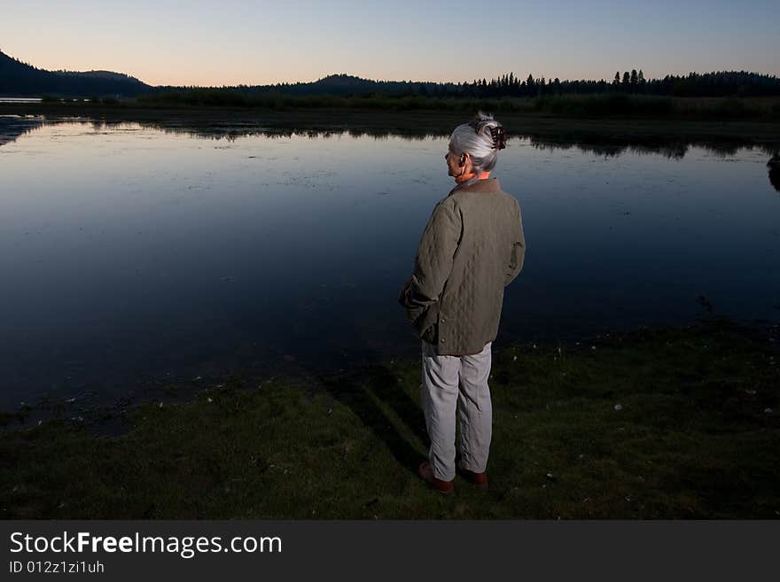 Senior woman looking at lake. Senior woman looking at lake