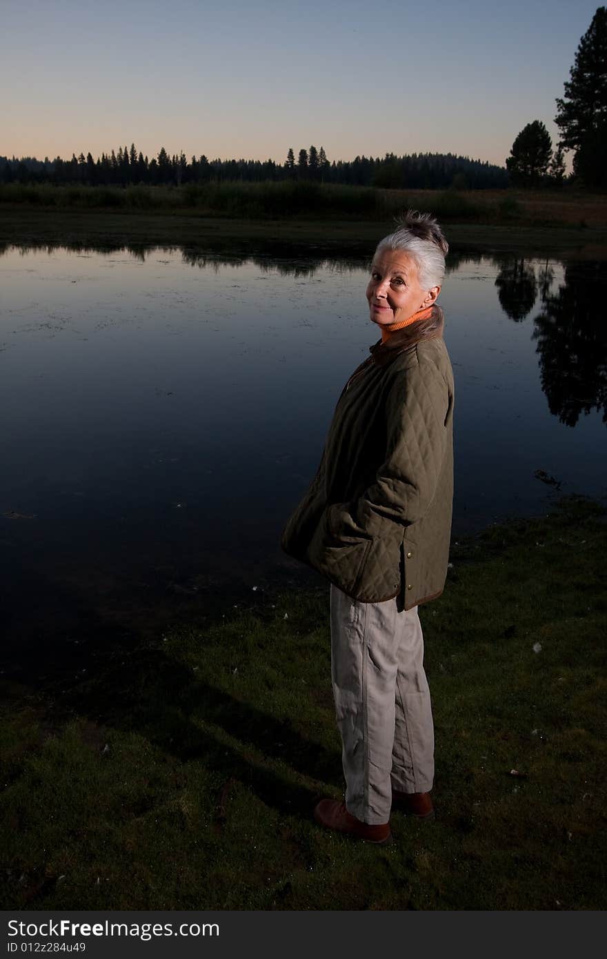 Senior woman looking at lake. Senior woman looking at lake