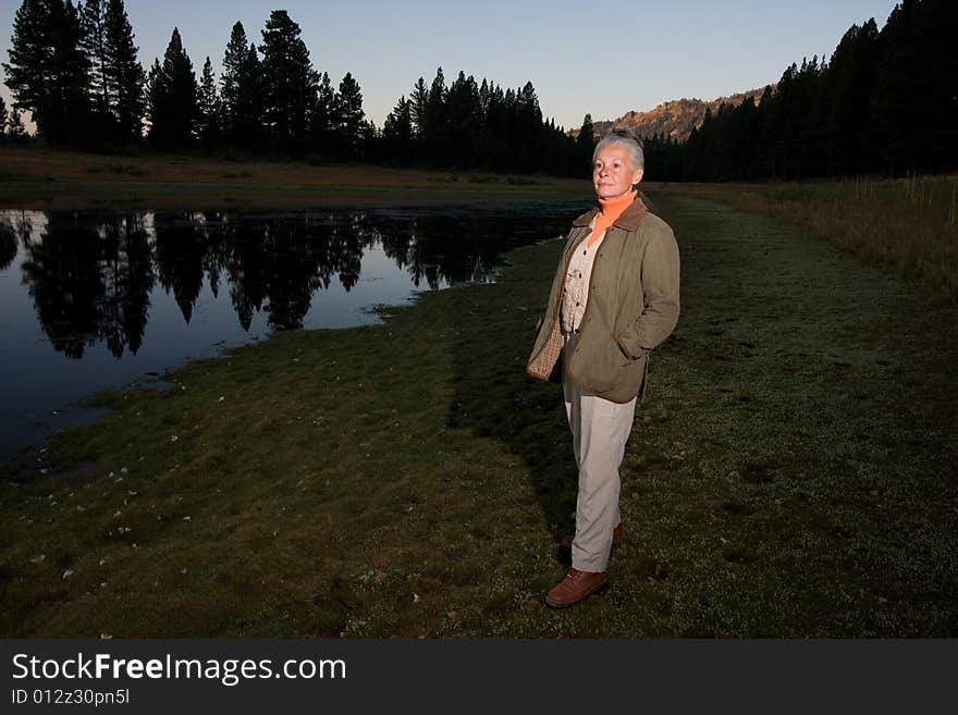 Senior woman looking at lake. Senior woman looking at lake