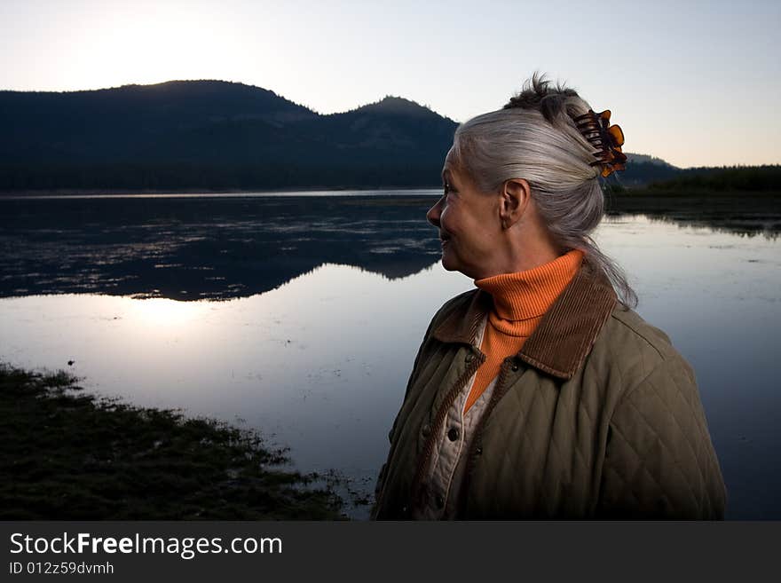 Senior woman looking at lake. Senior woman looking at lake