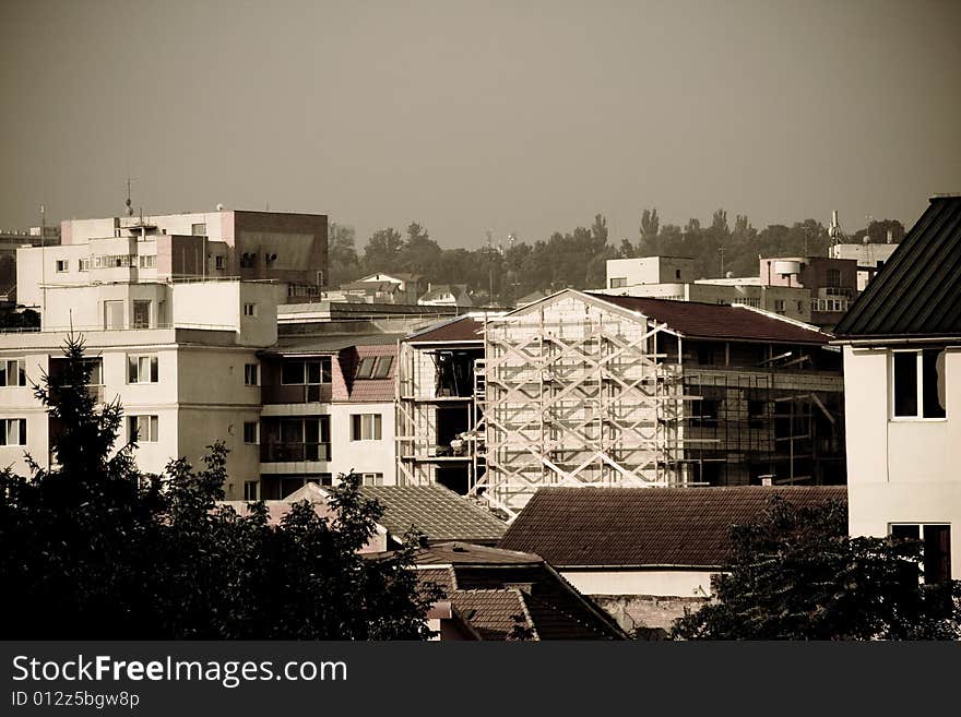 An urban landscape with a construction site. An urban landscape with a construction site