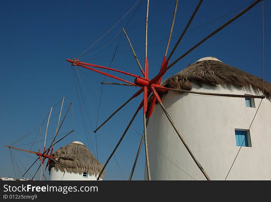 An image of the iconic windmills in Mykonos, Greece.