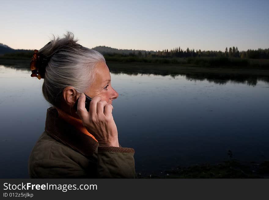 Senior woman looking at lake. Senior woman looking at lake