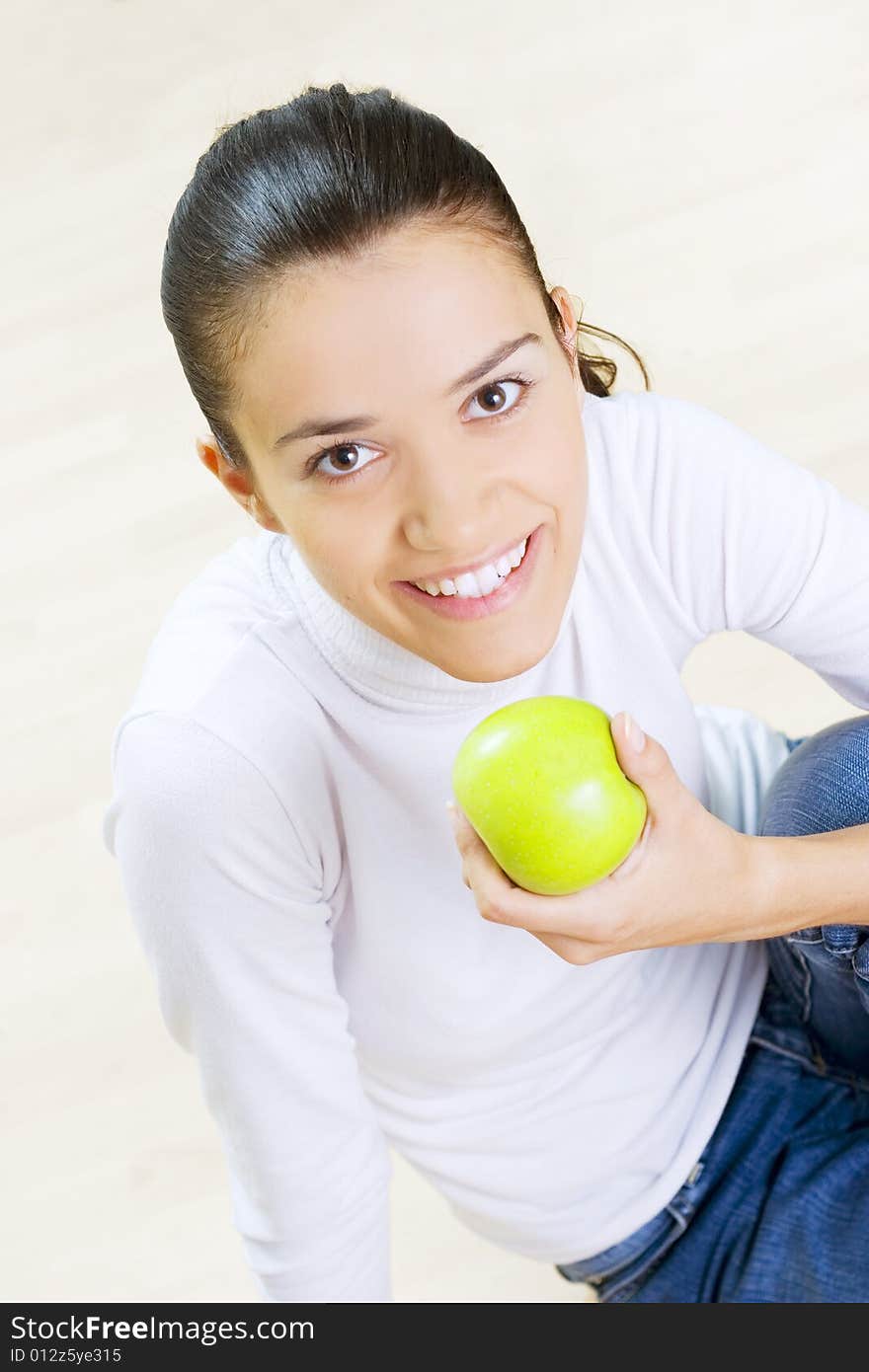 Woman eating fresh green apple