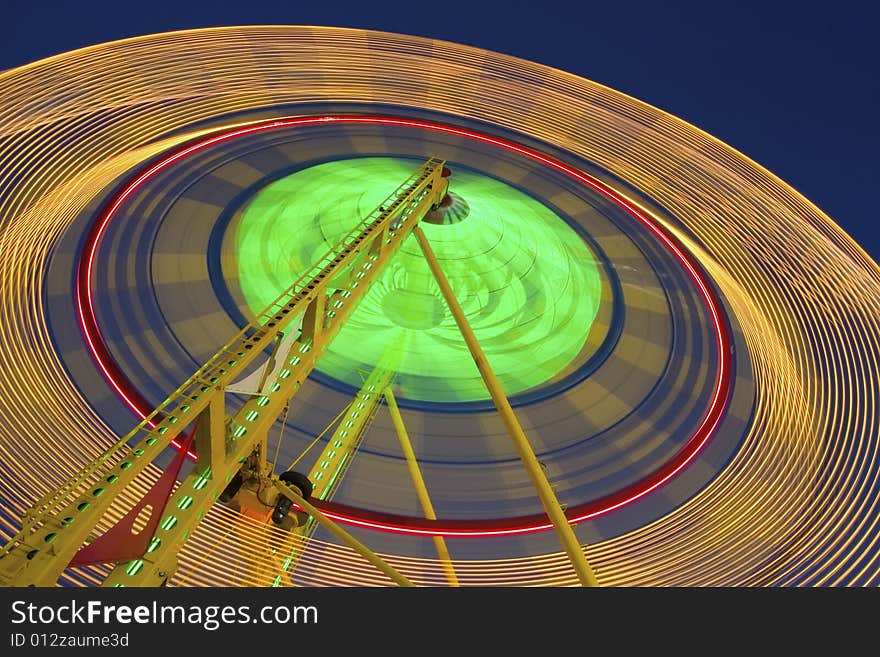 Carnival Ferris Wheel spinning fast