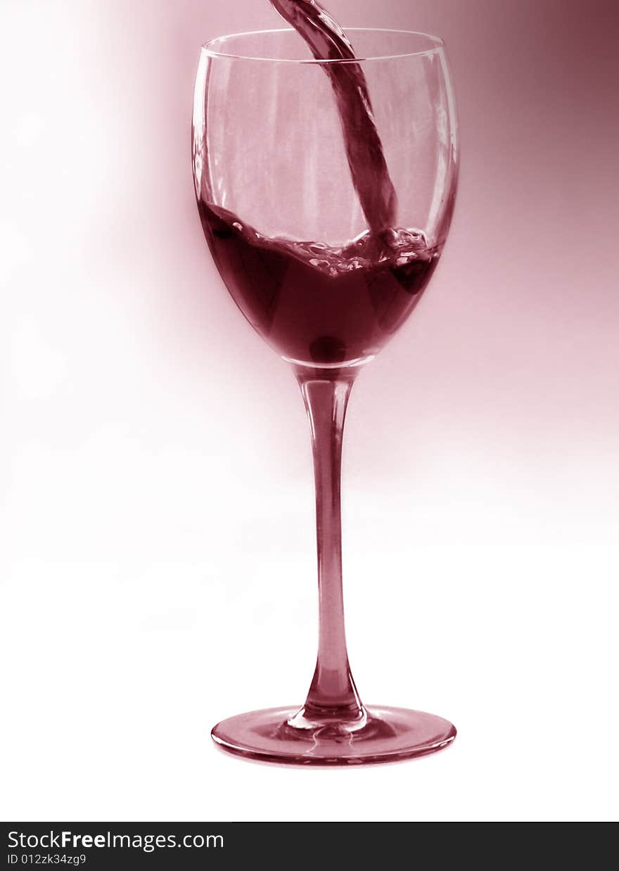 Pouring red wine into a glass