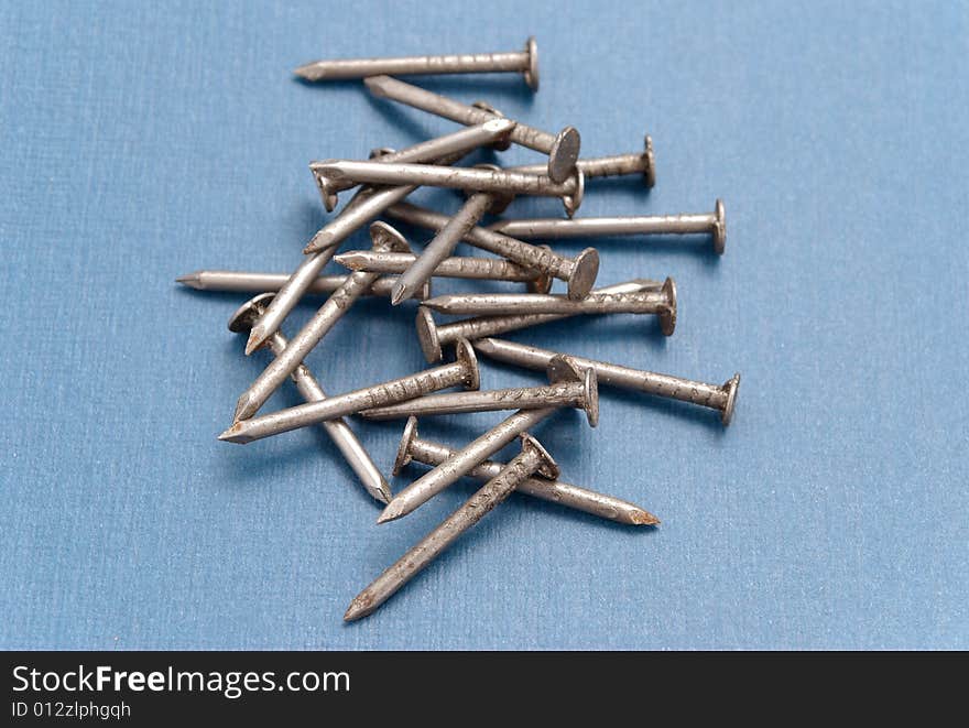 Isolated nails on blue background