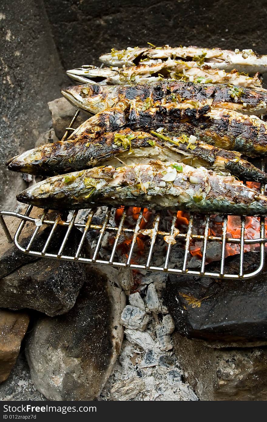 Grilled fishes on hot grill