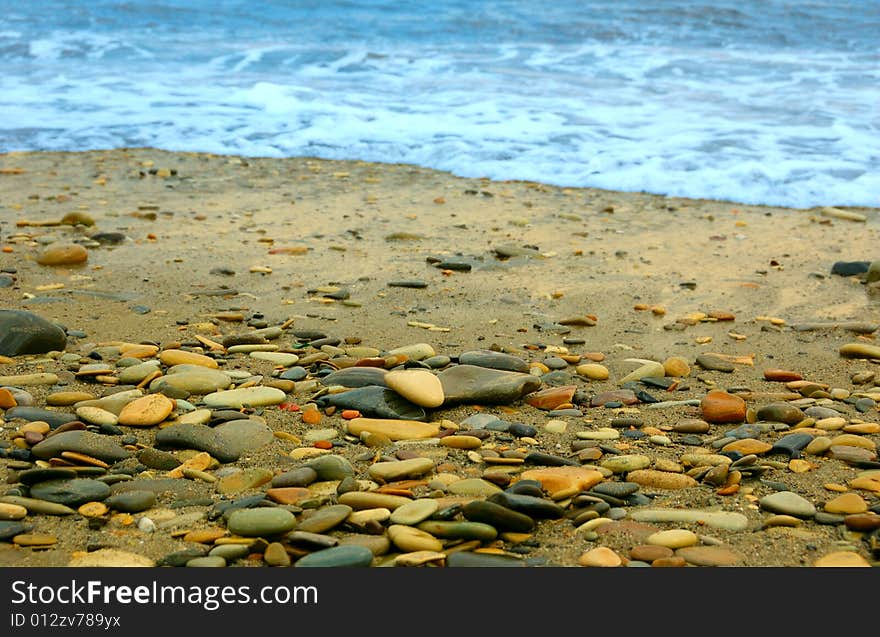 Closeup of sea shore covered with pebbles. Closeup of sea shore covered with pebbles