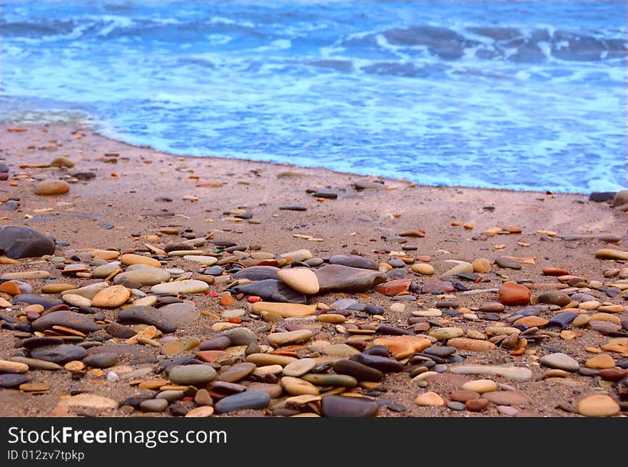 Closeup of sea shore covered with pebbles. Closeup of sea shore covered with pebbles