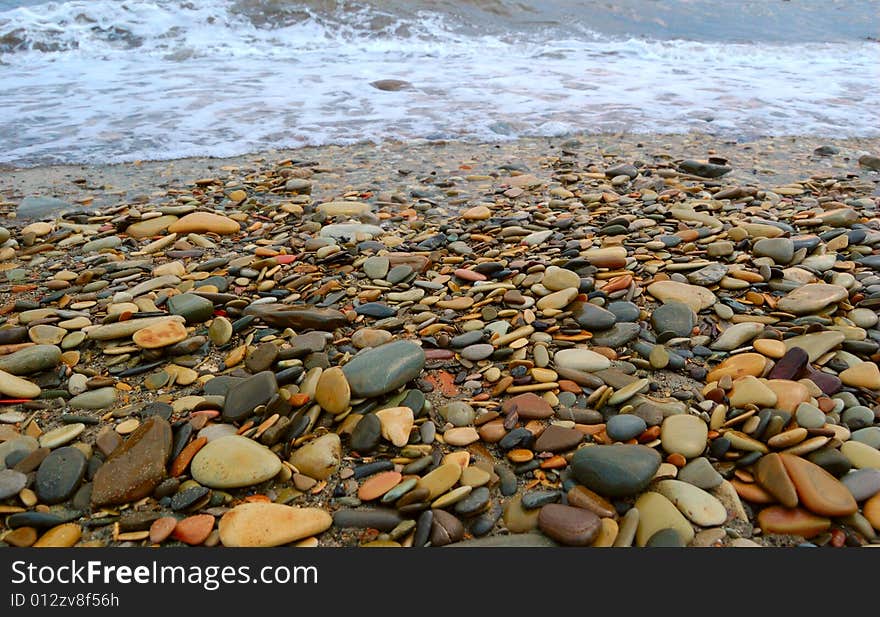 Closeup of sea shore covered with pebbles. Closeup of sea shore covered with pebbles