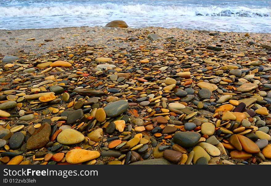 Closeup of sea shore covered with pebbles. Closeup of sea shore covered with pebbles