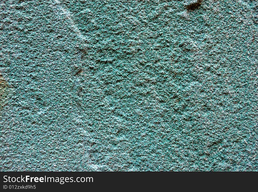 Colored (prevaling blue) rough stone surface