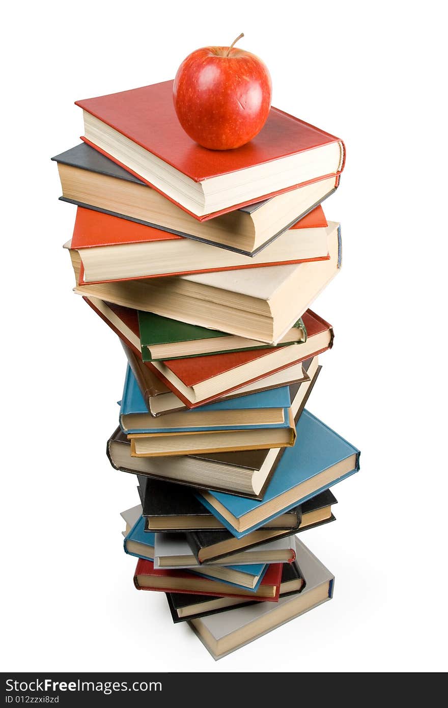 Pile of books and apple isolated on a white background. Concept for Back to school. Clipping path included.