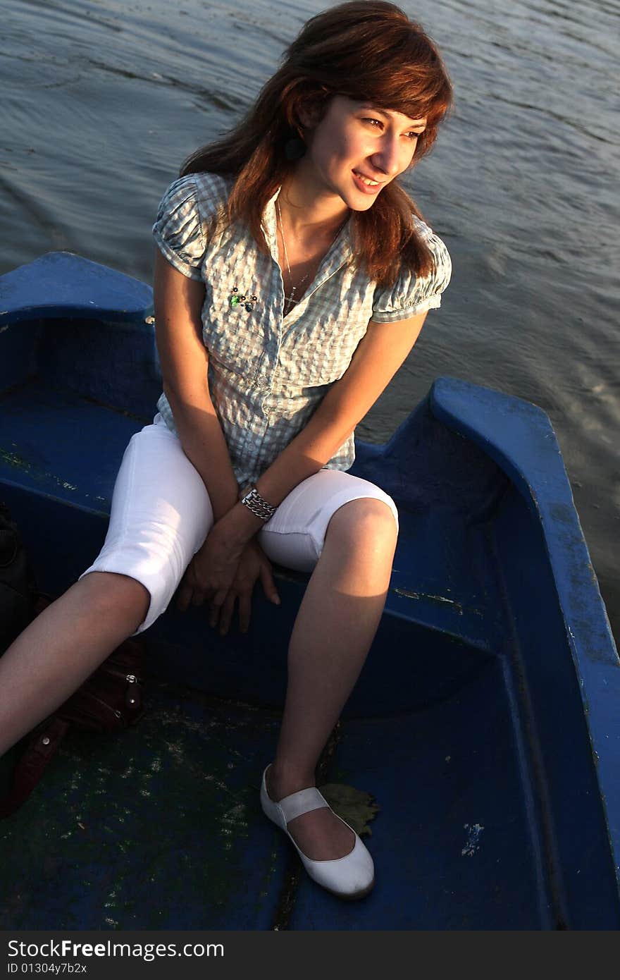 A beautiful lady alone on the boat. A beautiful lady alone on the boat