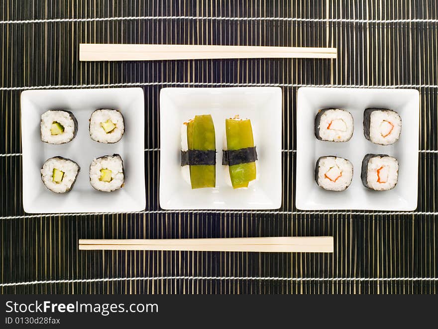 Three plates with different kinds of sushi