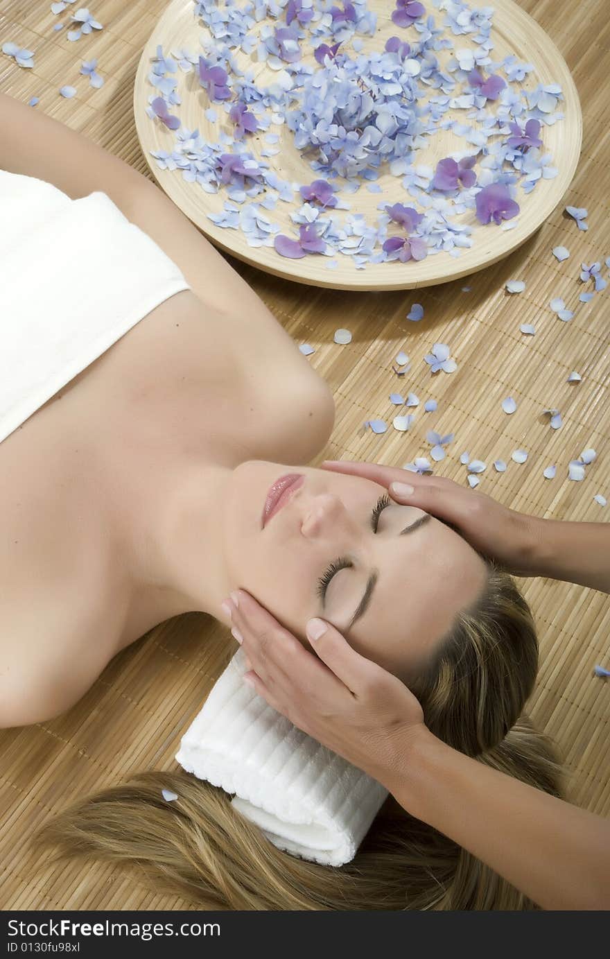 Woman in a day spa getting a deep tissue massage therapy