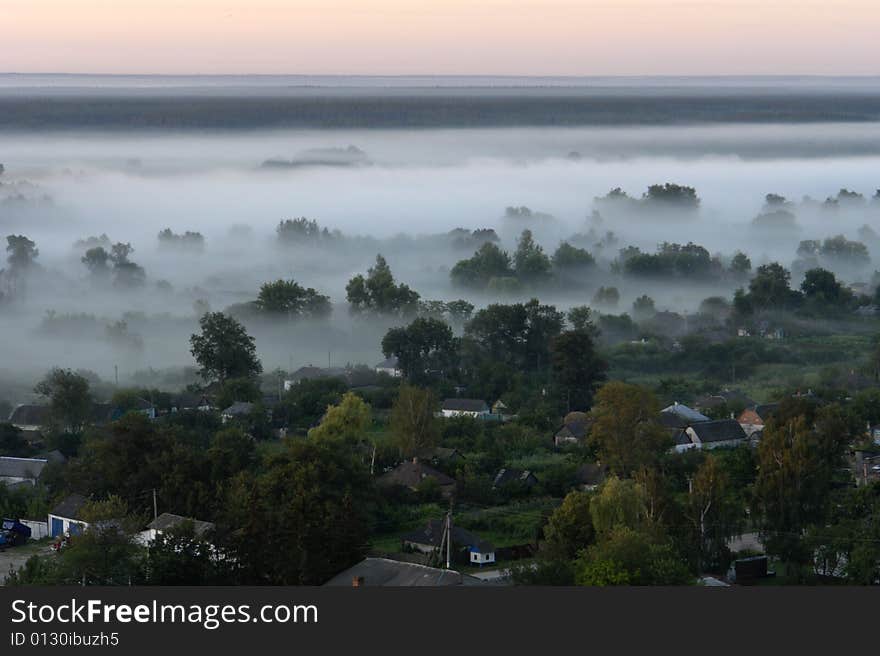 Village on a background of a fog