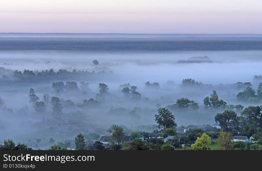 Village on a background of a fog