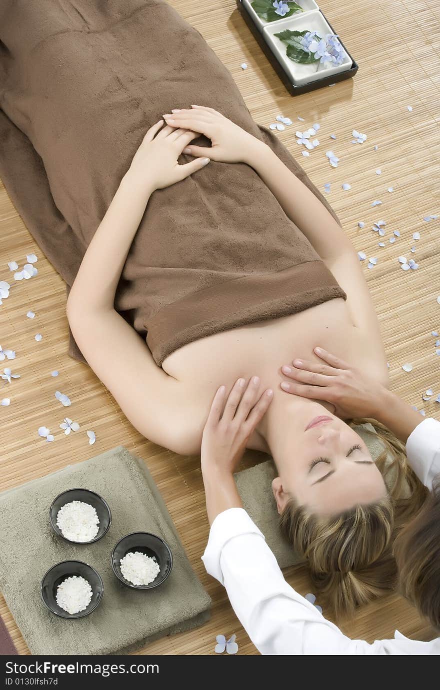 Woman in a day spa getting a deep tissue massage therapy