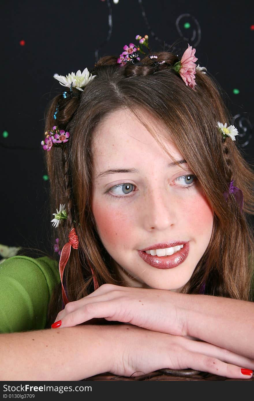 Teenage model with flowers and butterflies in her hair. Teenage model with flowers and butterflies in her hair