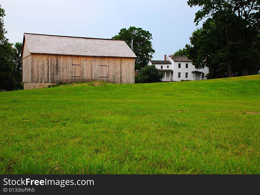 This is a shot of an old farmhouse with a new barn This is one happy farmer. The foundation is an original foundation from the old barn.