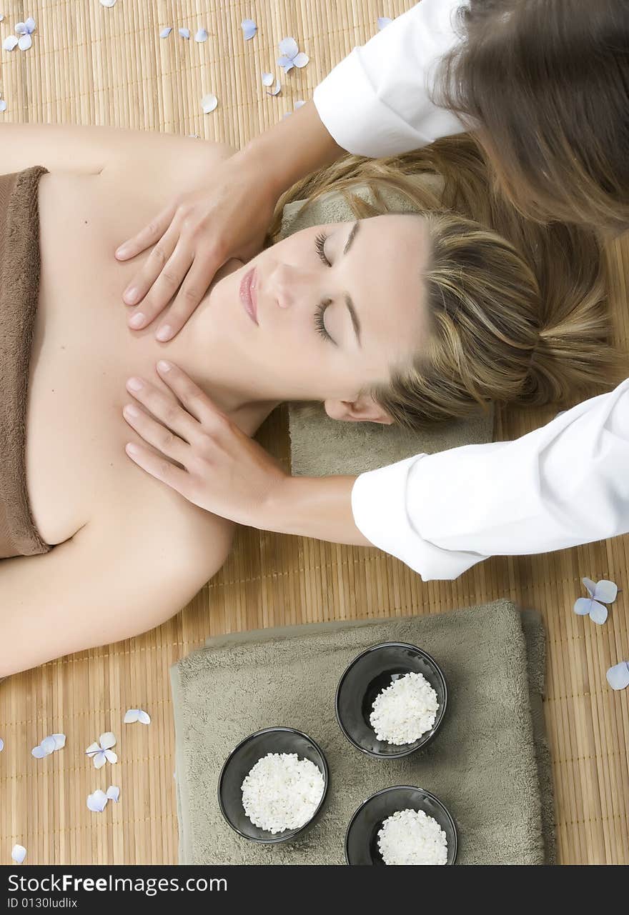 Woman in a day spa getting a deep tissue massage therapy