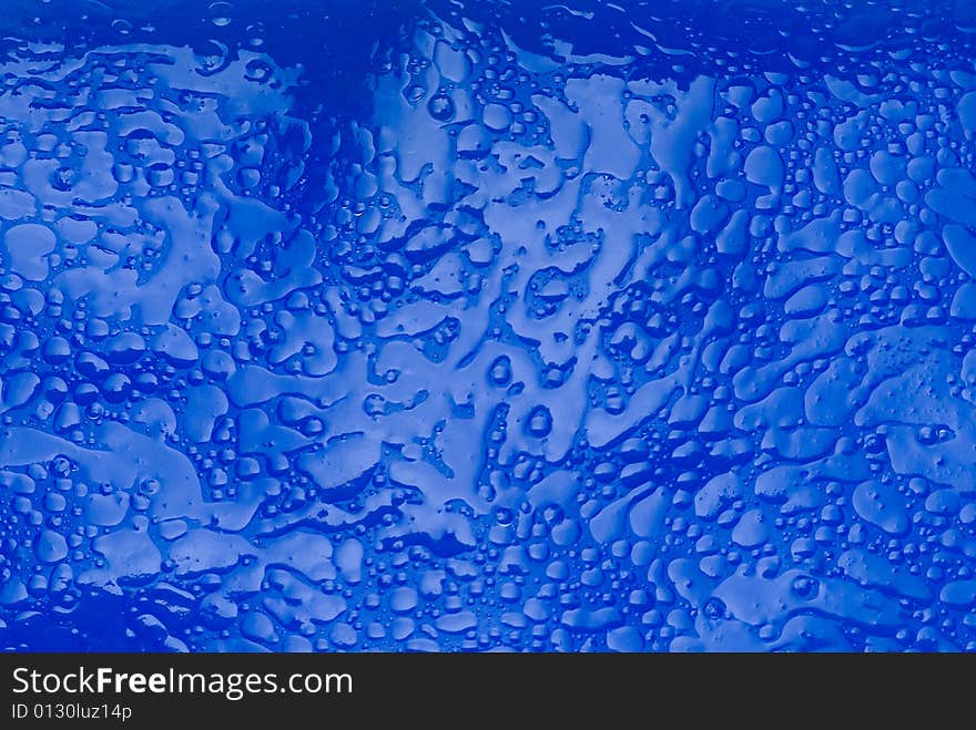 Textured oily viscous liquid background. Textured oily viscous liquid background