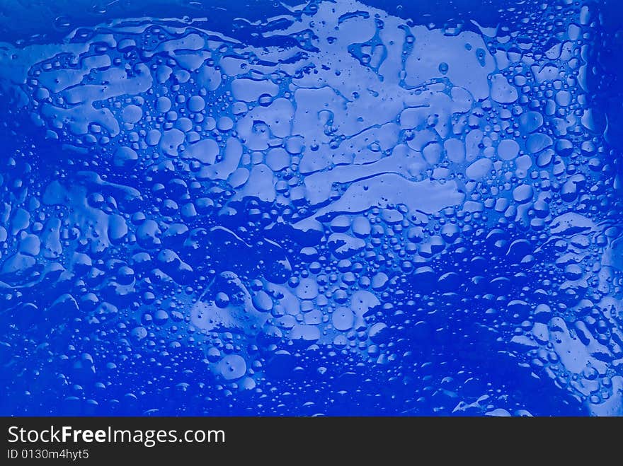 Textured oily viscous liquid background. Textured oily viscous liquid background