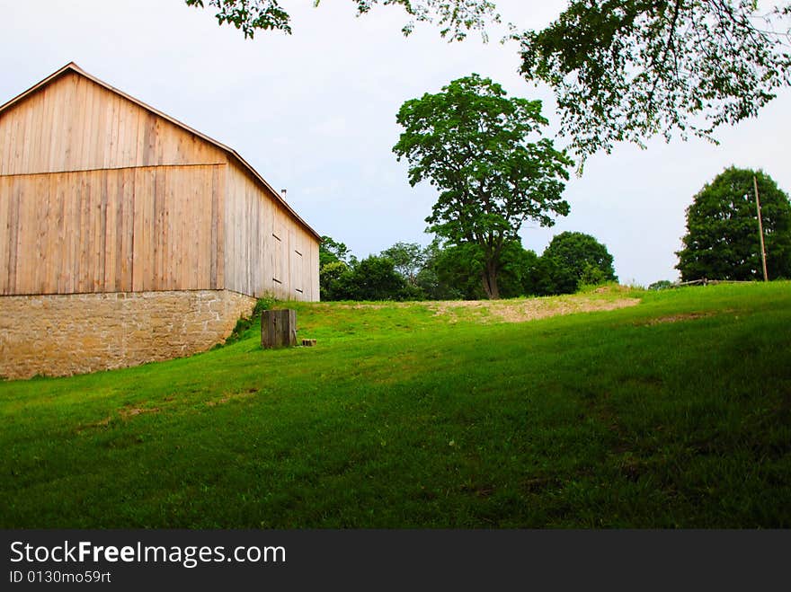 This is a shot of an old farmhouse with a new barn This is one happy farmer. The foundation is an original foundation from the old barn.