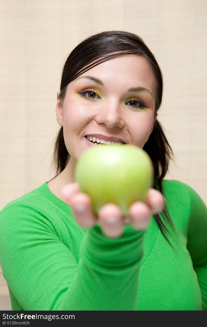 Attractive brunette woman with apple. Attractive brunette woman with apple