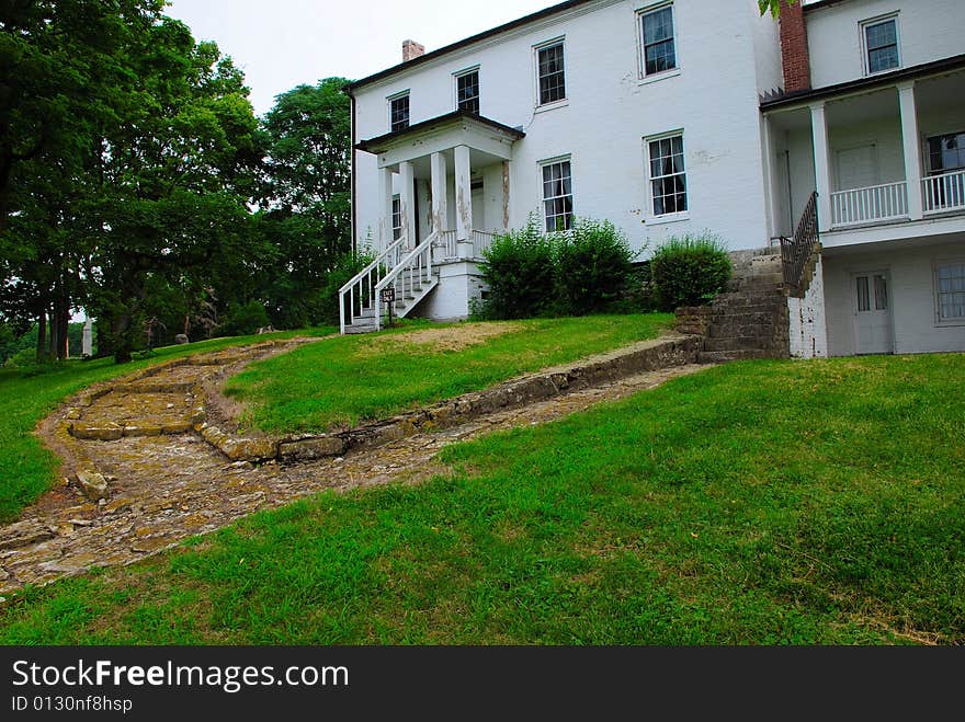 This is a shot of an old black and white painted farmhouse. This is a shot of an old black and white painted farmhouse.