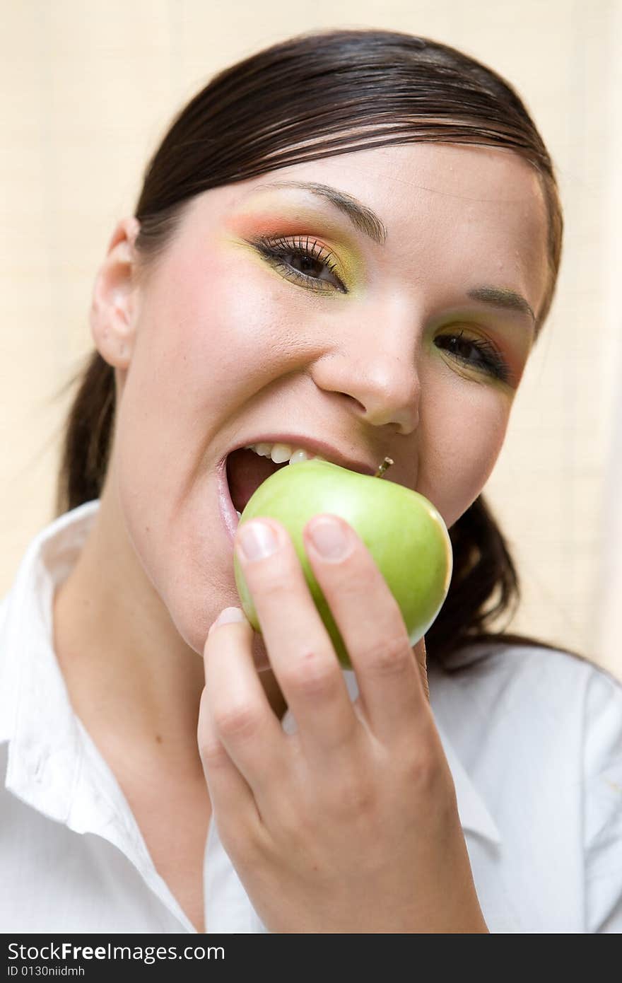 Attractive brunette woman with apple. Attractive brunette woman with apple